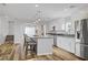 Well-lit kitchen with an island, stainless steel appliances, and stylish countertops at 1329 Jewelstone Cir, Henderson, NV 89012