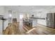 Bright, spacious kitchen with stainless steel appliances, large center island, and modern finishes at 1329 Jewelstone Cir, Henderson, NV 89012