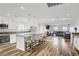 Open-concept kitchen with an island, stainless steel appliances, and modern lighting at 1329 Jewelstone Cir, Henderson, NV 89012