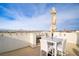 Expansive roof deck provides a private retreat with outdoor seating, a decorative fireplace, and panoramic mountain views at 1329 Jewelstone Cir, Henderson, NV 89012