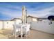 Open roof deck featuring outdoor seating, white stucco walls, and partial shade offering a private entertaining space at 1329 Jewelstone Cir, Henderson, NV 89012