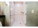 The bathroom features a stand up shower, updated fixtures and a neutral color palette at 145 Harmon Ave # 1021, Las Vegas, NV 89109
