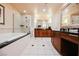 Spacious bathroom with a soaking tub and double sink vanity at 145 Harmon Ave # 1021, Las Vegas, NV 89109