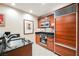 Classic kitchen with wood cabinets, stainless steel appliances, and black countertops at 145 Harmon Ave # 1021, Las Vegas, NV 89109