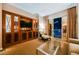 Elegant living room with plush seating, a glass coffee table, and built-in media center at 145 Harmon Ave # 1021, Las Vegas, NV 89109