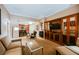 Comfortable living room featuring built-in entertainment center and open access to kitchen at 145 Harmon Ave # 1021, Las Vegas, NV 89109