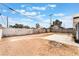 View of the spacious backyard with a mixture of dirt and some concrete at 1520 Teton St, Las Vegas, NV 89101