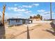 Wide angle shot of the property's backyard with a concrete pad and partial fence at 1520 Teton St, Las Vegas, NV 89101