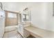 A neutral toned bathroom featuring a tub, vanity, and countertop at 1520 Teton St, Las Vegas, NV 89101