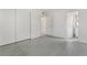 Bright bedroom featuring gray wood-look floors, closet and entryway to a bathroom at 1520 Teton St, Las Vegas, NV 89101