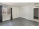 This bedroom has gray wood-look floors, window with dark drapes, and a closet at 1520 Teton St, Las Vegas, NV 89101