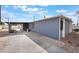 Charming single story home with carport and blue painted exterior at 1520 Teton St, Las Vegas, NV 89101