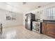 Kitchen featuring stainless steel appliances, tile floors, and a window at 1520 Teton St, Las Vegas, NV 89101