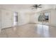 Bright living room featuring tiled floor, ceiling fan, and sliding glass doors at 1520 Teton St, Las Vegas, NV 89101