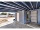 Covered patio with exposed beam ceiling and gated entry to the backyard at 1520 Teton St, Las Vegas, NV 89101