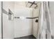 Tiled shower with mosaic floor, shower niche, and adjustable shower head at 1520 Teton St, Las Vegas, NV 89101