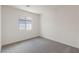 Inviting bedroom with carpeted floors, and bright white walls at 1713 Desert Path Ave, North Las Vegas, NV 89032