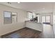 Open-concept kitchen with counter seating, modern appliances, and a seamless transition to the dining area at 1713 Desert Path Ave, North Las Vegas, NV 89032