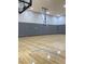 Indoor basketball court with wooden floor and multiple hoops at 172 Tall Ruff Dr, Las Vegas, NV 89148