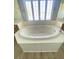 The bathroom features an oval soaking tub with a window view, adding a touch of luxury and natural light at 172 Tall Ruff Dr, Las Vegas, NV 89148