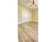 Bedroom boasts wood-look floors, ceiling fan, and ample natural light, creating a cozy and inviting space at 172 Tall Ruff Dr, Las Vegas, NV 89148