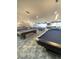 Luxurious billiard room with multiple pool tables and a stylish interior design at 172 Tall Ruff Dr, Las Vegas, NV 89148