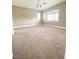 The carpeted bonus room provides ample space and is well-lit with bright natural light at 172 Tall Ruff Dr, Las Vegas, NV 89148