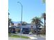 Gated community entrance with lush landscaping, decorative architecture, and clear blue skies at 172 Tall Ruff Dr, Las Vegas, NV 89148