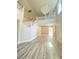 Bright foyer featuring a crystal chandelier, staircase, and open layout with wood flooring at 172 Tall Ruff Dr, Las Vegas, NV 89148