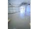Clean, well-lit garage interior with smooth concrete flooring and modern door openers at 172 Tall Ruff Dr, Las Vegas, NV 89148