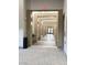 Long hallway with framed walls and recessed lighting leading to an exit at 172 Tall Ruff Dr, Las Vegas, NV 89148