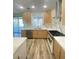 Modern kitchen featuring stainless steel appliances, wood cabinets, and marble countertops and backsplash at 172 Tall Ruff Dr, Las Vegas, NV 89148