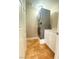 Efficient laundry area with stacked washer and dryer, storage cabinet, and tile flooring at 172 Tall Ruff Dr, Las Vegas, NV 89148