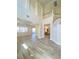 Spacious open living room with wood floors, high ceilings, and seamless flow to the kitchen at 172 Tall Ruff Dr, Las Vegas, NV 89148