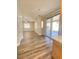 Bright living room with modern wood-look flooring, lots of natural light, and ceiling fan at 172 Tall Ruff Dr, Las Vegas, NV 89148