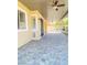 Covered patio with stone tile flooring and ceiling fans, perfect for outdoor living at 172 Tall Ruff Dr, Las Vegas, NV 89148