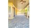 Inviting covered patio with stone flooring and ceiling fans for relaxing outdoors at 172 Tall Ruff Dr, Las Vegas, NV 89148