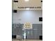 Pickleball court behind glass doors, clearly labeled with court regulations at 172 Tall Ruff Dr, Las Vegas, NV 89148