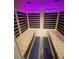 Inside the sauna, highlighting wooden benches and soft, colorful lighting at 172 Tall Ruff Dr, Las Vegas, NV 89148