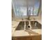 A sleek stainless steel sink sits beneath a bright window and a marble countertop at 172 Tall Ruff Dr, Las Vegas, NV 89148