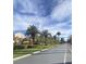 Scenic street view with manicured lawns, mature trees, and lovely community homes at 172 Tall Ruff Dr, Las Vegas, NV 89148
