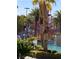 Community water park with slides and other water features, surrounded by lush landscaping at 172 Tall Ruff Dr, Las Vegas, NV 89148