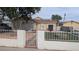 Beautiful house with a well-maintained yard, decorative mailbox and gated entry at 1910 Hoover St, North Las Vegas, NV 89030
