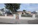 Charming single-story home with manicured front yard, secure fencing and a vintage-style mailbox at 1910 Hoover St, North Las Vegas, NV 89030