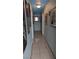 The hallway showcases unique wall decor and lighting, enhancing the home's aesthetic appeal at 1910 Hoover St, North Las Vegas, NV 89030