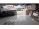 Covered patio with tile flooring, view to the fenced backyard, and tile details around the walls at 1910 Hoover St, North Las Vegas, NV 89030