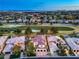 Wide aerial shot showcasing a home with a red tile roof near a golf course, set against a stunning cityscape at 1912 Glenview Dr, Las Vegas, NV 89134