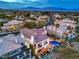 Stunning aerial view of a neighborhood showcasing luxurious homes, lush greenery, and inviting pools in a desirable location at 1912 Glenview Dr, Las Vegas, NV 89134