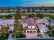 Beautiful aerial view of a home with a well-manicured lawn, a red tile roof, and a golf course backdrop at 1912 Glenview Dr, Las Vegas, NV 89134