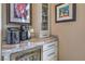 Elegant bar area with marble countertop, wine fridge, and custom cabinetry at 1912 Glenview Dr, Las Vegas, NV 89134